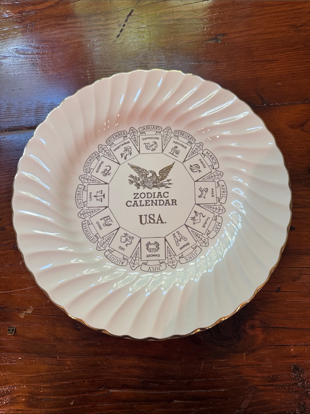 vintage Sheffield USA ceramic plate with eagle emblem and twelve zodiac signs
